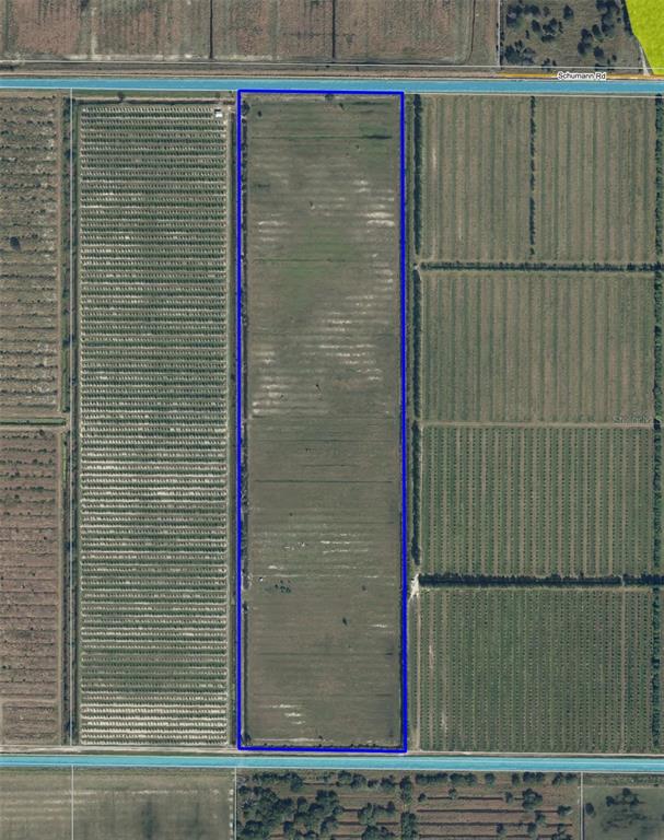 This aerial map shows a rectangular plot of land bordered by roads and agricultural fields — SCHUMANN ROAD, FORT PIERCE, FL