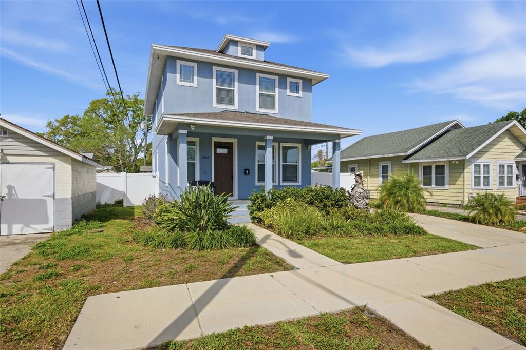 A two-story blue house with a front porch and a concrete walkway — 3222 PRESCOTT STREET N, ST PETERSBURG, FL