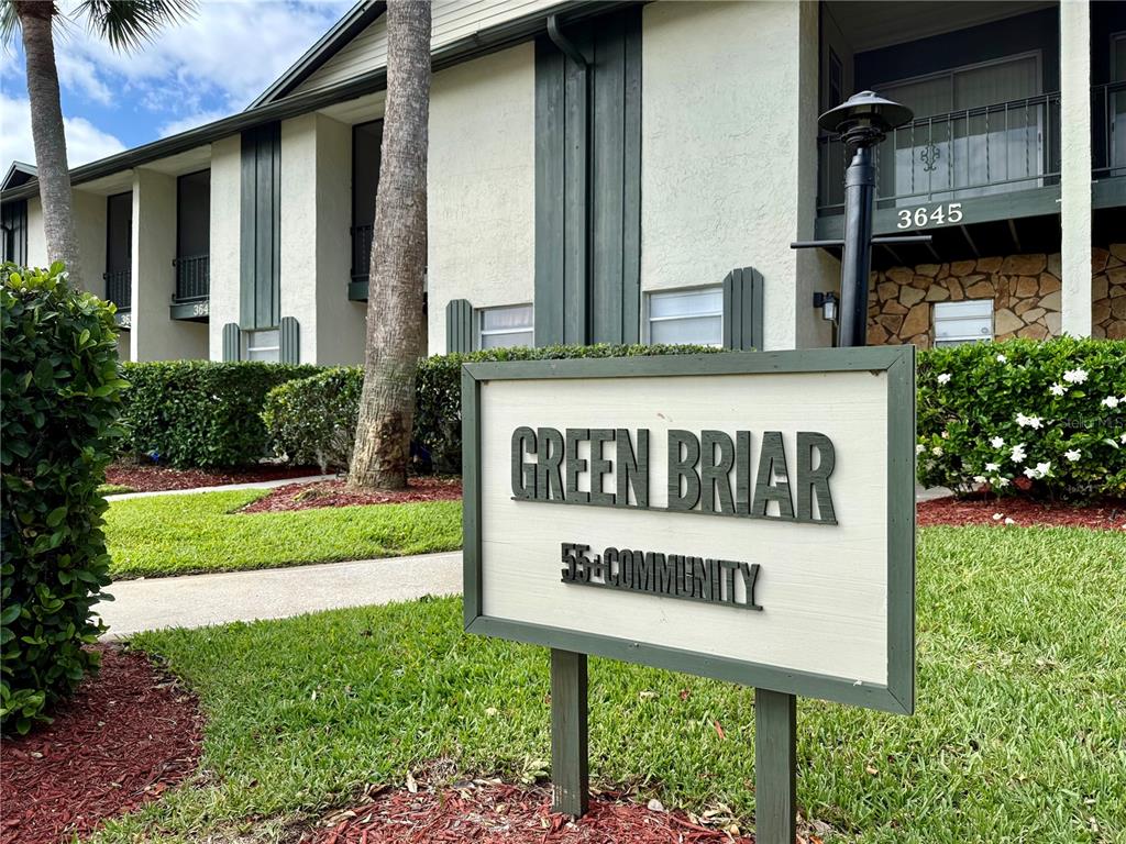 A sign for a 55+ community stands in front of a two-story apartment building — 3635 EDGEWATER DRIVE UNIT 3635, SEBRING, FL