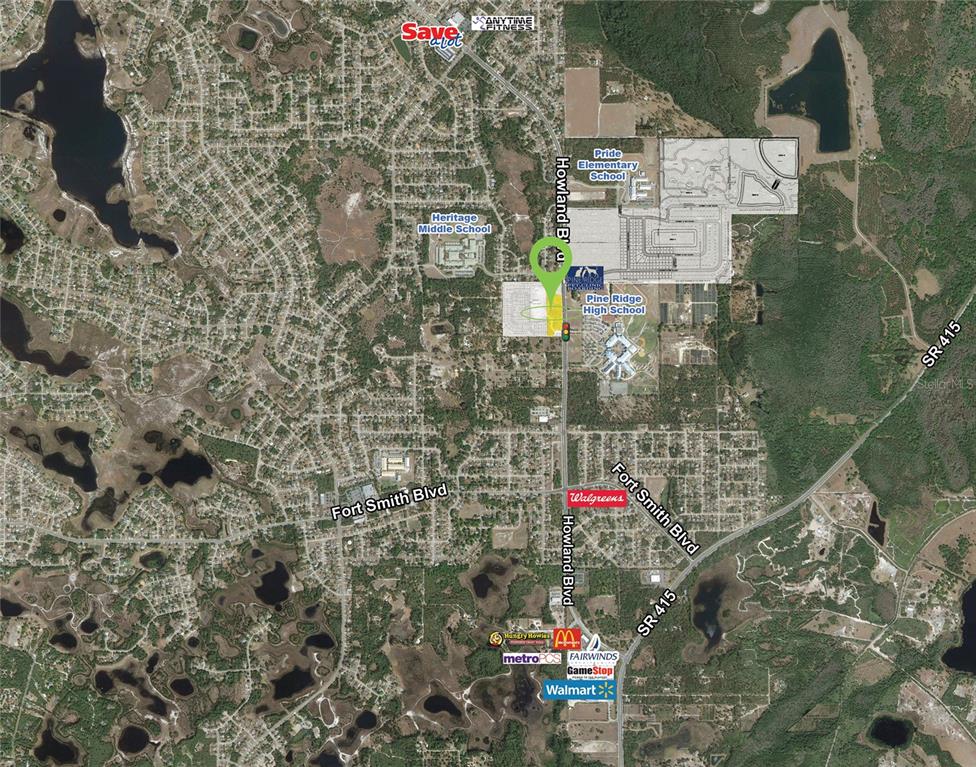 This is an aerial map showing local schools, businesses, and road networks in a residential area — 937 HOWLAND BOULEVARD, DELTONA, FL