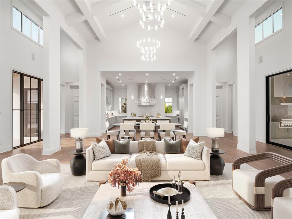 This rendering shows a spacious, high-ceilinged open-concept living room and kitchen with modern decor — 9316 GLADYS GARDEN CT, WINDERMERE, FL