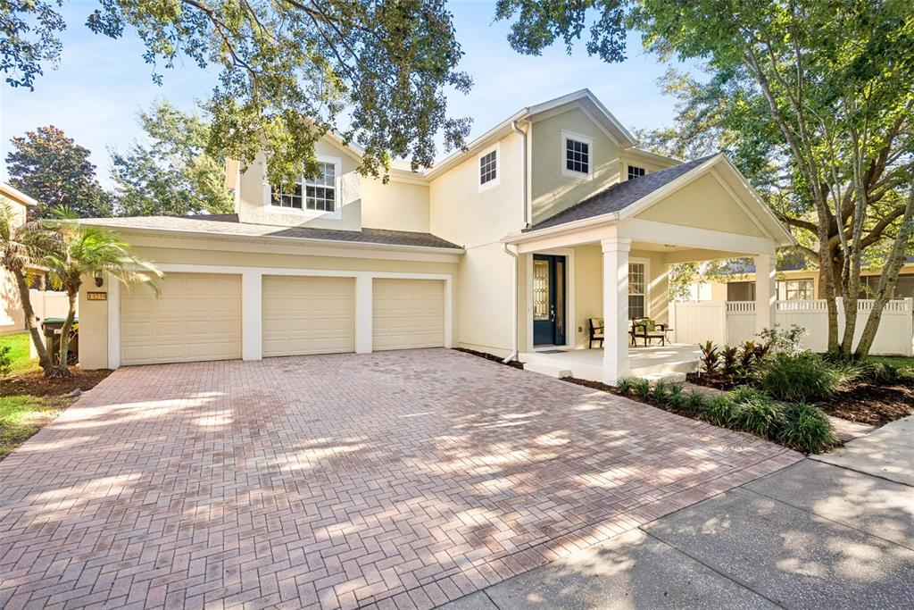 A two-story house with a three-car garage and a covered front porch — 13239 JERVEY STREET, WINDERMERE, FL