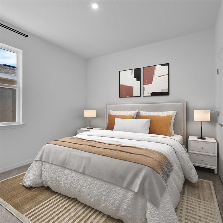 A bedroom features a queen bed with neutral bedding, two nightstands, and two abstract wall prints — 6743 WINTERBERRY DRIVE, LAKE HAMILTON, FL