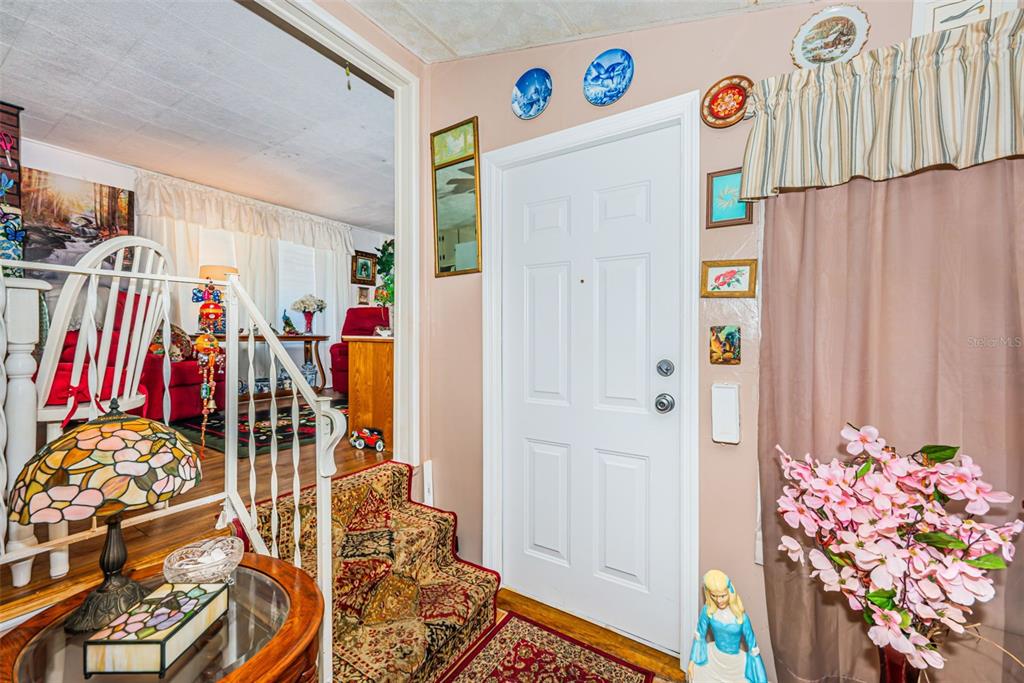 This is a floor plan of a one-bedroom apartment with a living room and kitchen — 4187 72ND STREET N UNIT 32, ST PETERSBURG, FL