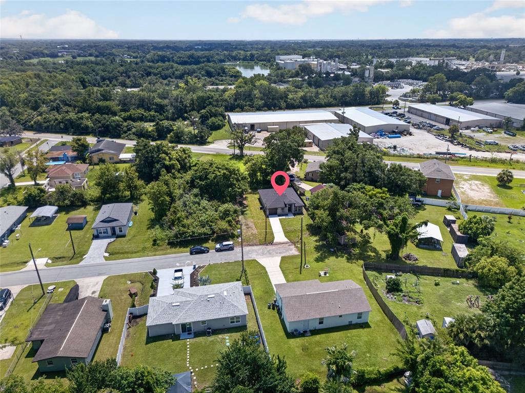An aerial view shows a single-story house with a red location pin on a lot — 2225 MCCARTHY AVENUE, SANFORD, FL