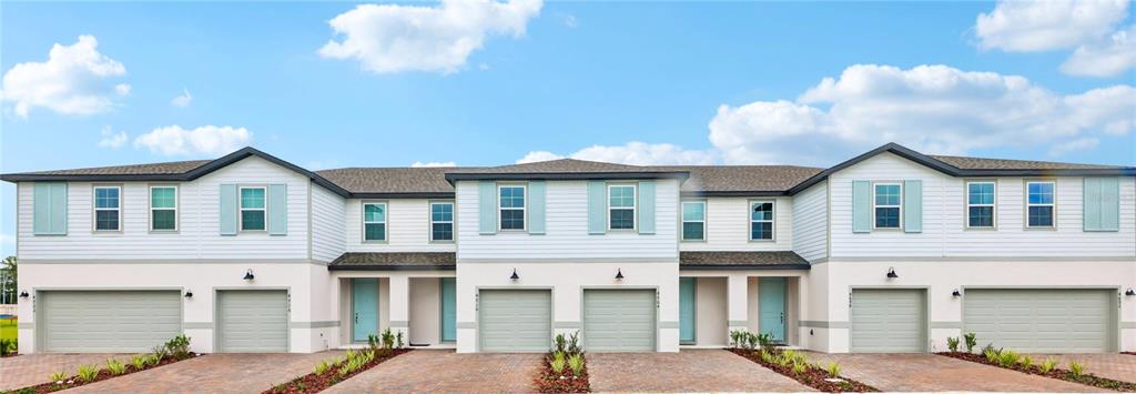 A paved walkway leads to the entrance of a building with an exterior HVAC unit — 4457 STARLING GROVE DRIVE, ORLANDO, FL