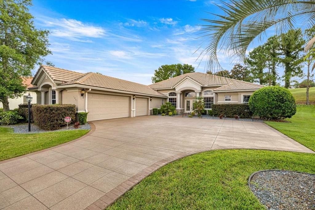 A single-story house with a three-car garage and a large concrete driveway — 1861 N EAGLE CHASE DRIVE, HERNANDO, FL