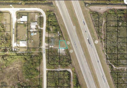 An aerial map view shows a highlighted vacant lot adjacent to a highway and local roads — I-95, VERO BEACH, FL