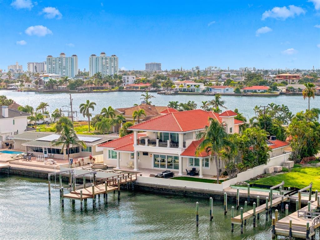 An aerial view of a waterfront house with a red tile roof and a private dock — 504 55 TH AVENUE, ST PETE BEACH, FL