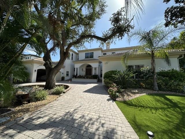 A paved driveway leads to the front entrance of a two-story house with palm trees — 1444 HARBOR DRIVE, SARASOTA, FL