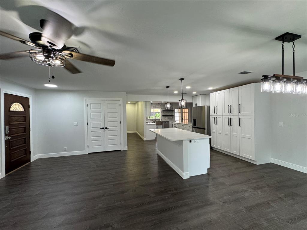 This floor plan shows a single-story house with a garage, multiple bedrooms, and outdoor patios — 1809 STELLA COURT N, LAKELAND, FL