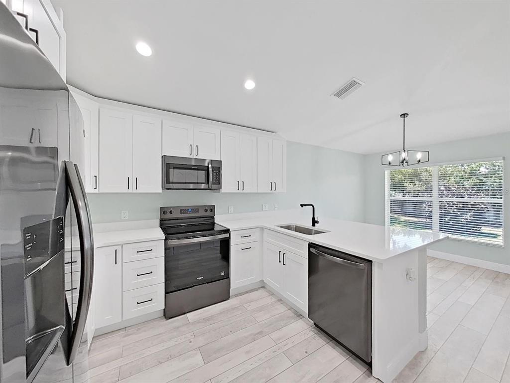 1025 LAKE AVOCA PLACE, TARPON SPRINGS, FL — photo 3 of 30