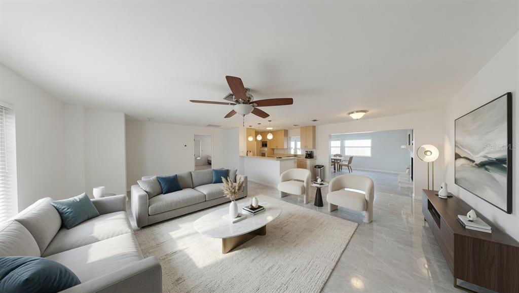 A living room features a grey sofa, two armchairs, a marble coffee table, and tile flooring — 5864 MARIGOLD ROAD, VENICE, FL