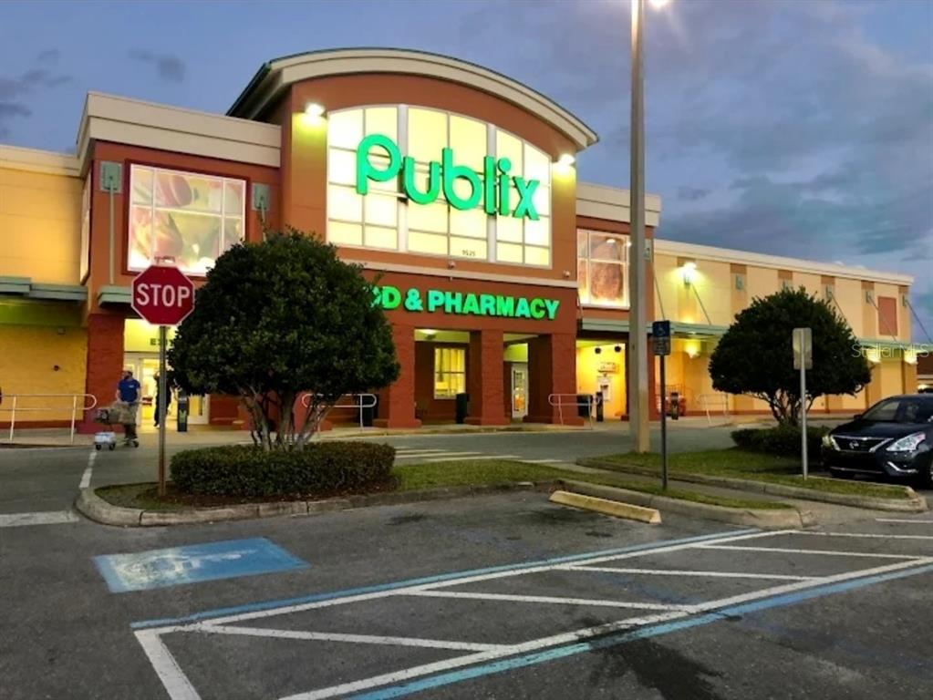 The exterior of a Publix grocery store features a large sign, parking lot, and landscaping — 13 SCABIOSA COURT, HOMOSASSA, FL