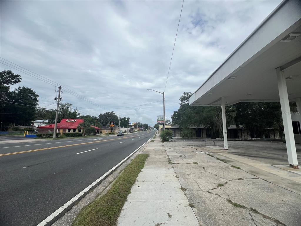 A view of a roadside with a gas station canopy and a nearby Pizza Hut — 1327 E SILVER SPRINGS BOULEVARD, OCALA, FL