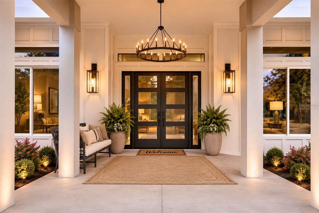 A modern house with a pool, patio, and outdoor living area at sunset — 12000 GOLDEN VALLEY DRIVE, NEW PORT RICHEY, FL