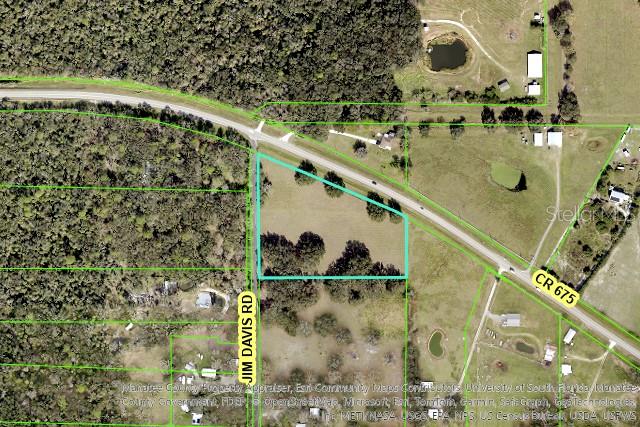 This aerial map shows a vacant, rectangular parcel of land bordered by two roads — 6720 JIM DAVIS ROAD, PARRISH, FL