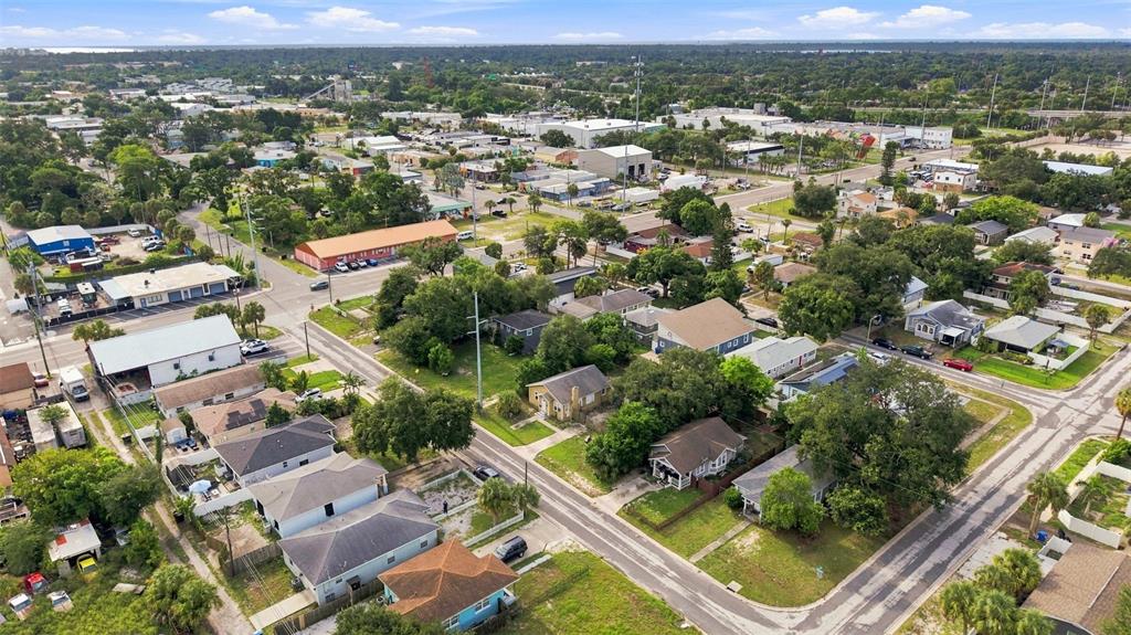 An aerial view shows a residential neighborhood with houses, streets, and nearby commercial buildings — 2848 EMERSON AVENUE S, ST PETERSBURG, FL