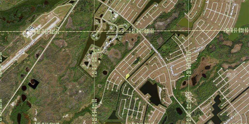This is an aerial map showing a vacant residential lot highlighted in yellow within a neighborhood — 12208 or 12218 PADDLEFISH COURT, PLACIDA, FL