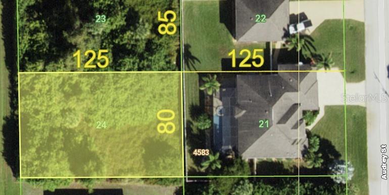 This is an aerial map showing property lot lines and dimensions for several residential parcels — 10052 CALUMET BOULEVARD, PORT CHARLOTTE, FL