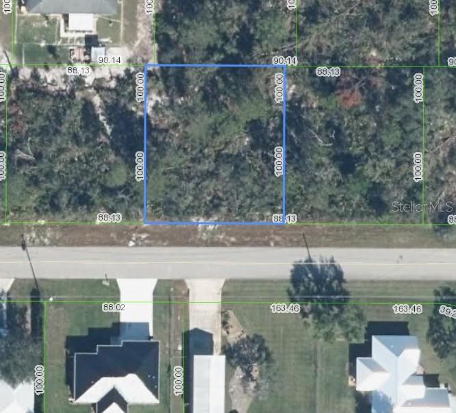 This aerial map shows a rectangular plot of land highlighted in blue with property dimensions — 4512 SHAMROCK STREET, SEBRING, FL