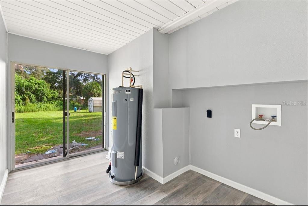 A single-story house with a gray exterior, white brick base, and a front walkway — 8 SMYRNA DRIVE, DEBARY, FL