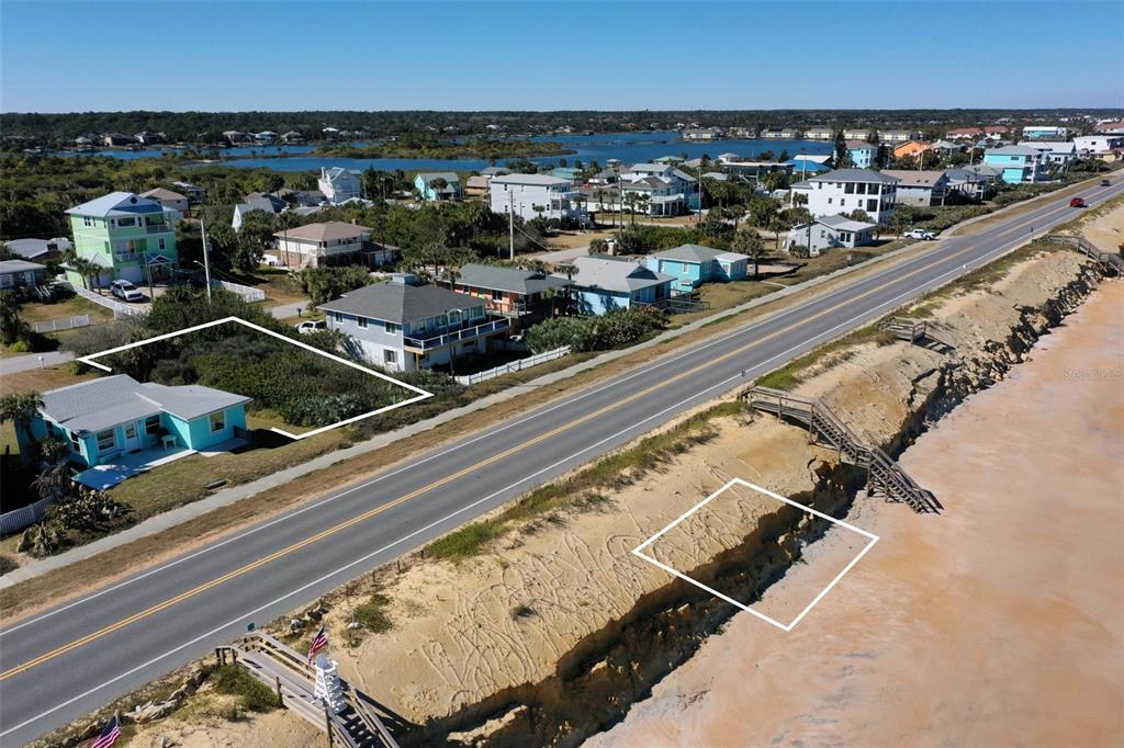 An aerial view shows a beach with a sand dune, a road, and several coastal houses — 1922 N CENTRAL AVENUE, FLAGLER BEACH, FL