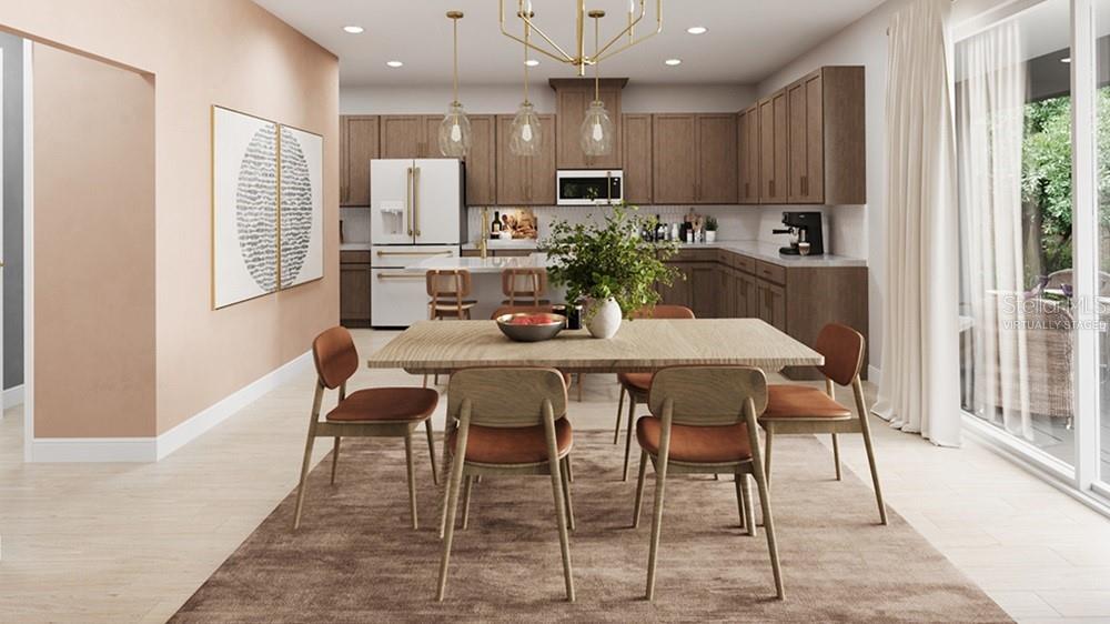 This is a virtual rendering of a dining area and kitchen with wood cabinetry — 7828 CENTAURUS WAY, SARASOTA, FL