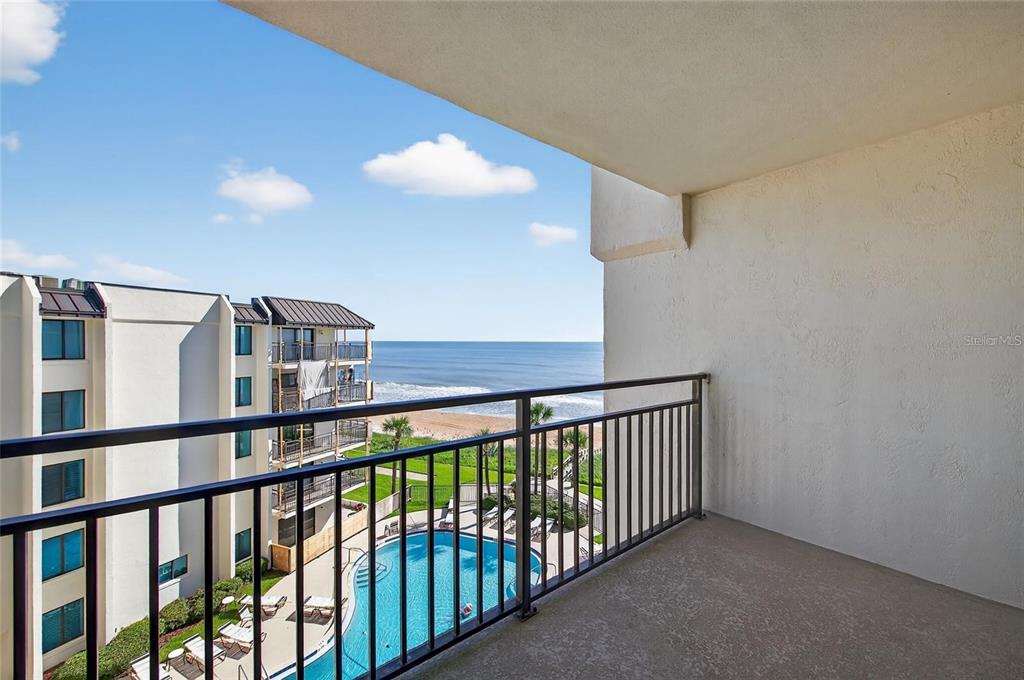 A balcony overlooks a swimming pool, a sandy beach, and the ocean — 1275 OCEAN SHORE BOULEVARD UNIT P3, ORMOND BEACH, FL