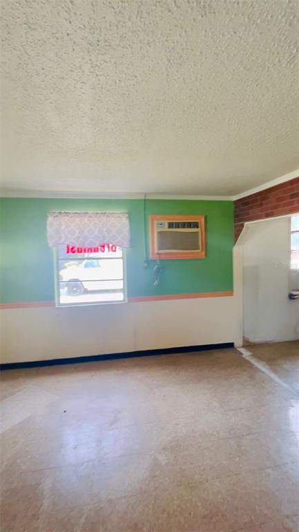 An interior room features green and white walls, a window with a curtain, and an air conditioner — 7103 N CARL G ROSE HIGHWAY, HERNANDO, FL