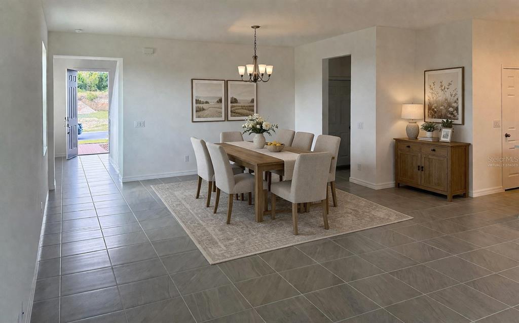 A dining room with a wooden table, six chairs, a rug, and a side cabinet — 6708 SPOTTED EAGLE LOOP, HOWEY IN THE HILLS, FL