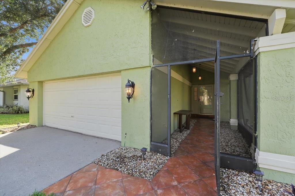An aerial view shows a single-story house with a red roof and a fenced backyard — 20828 MAXIM PARKWAY, ORLANDO, FL