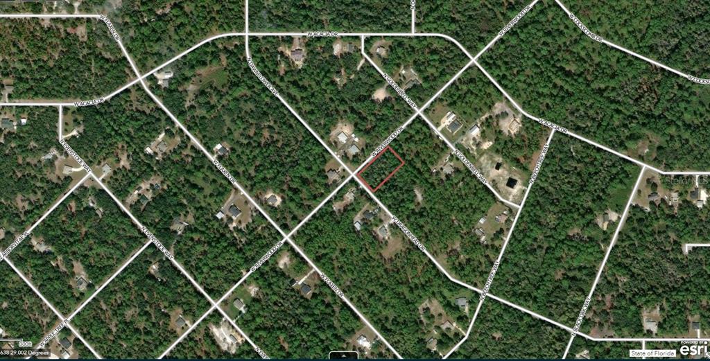 This is an aerial map showing a vacant, rectangular lot outlined in red within a neighborhood — 11645 W DRAGONHEAD DRIVE, CRYSTAL RIVER, FL