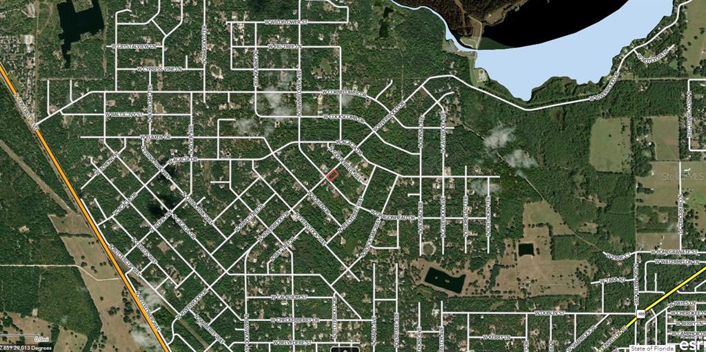 This is an aerial map showing a residential neighborhood with a highlighted property lot — 11645 W DRAGONHEAD DRIVE, CRYSTAL RIVER, FL