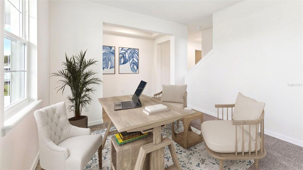 A home office features a wooden desk, two chairs, a potted plant, and wall art — 300 BRACER WAY, ORMOND BEACH, FL