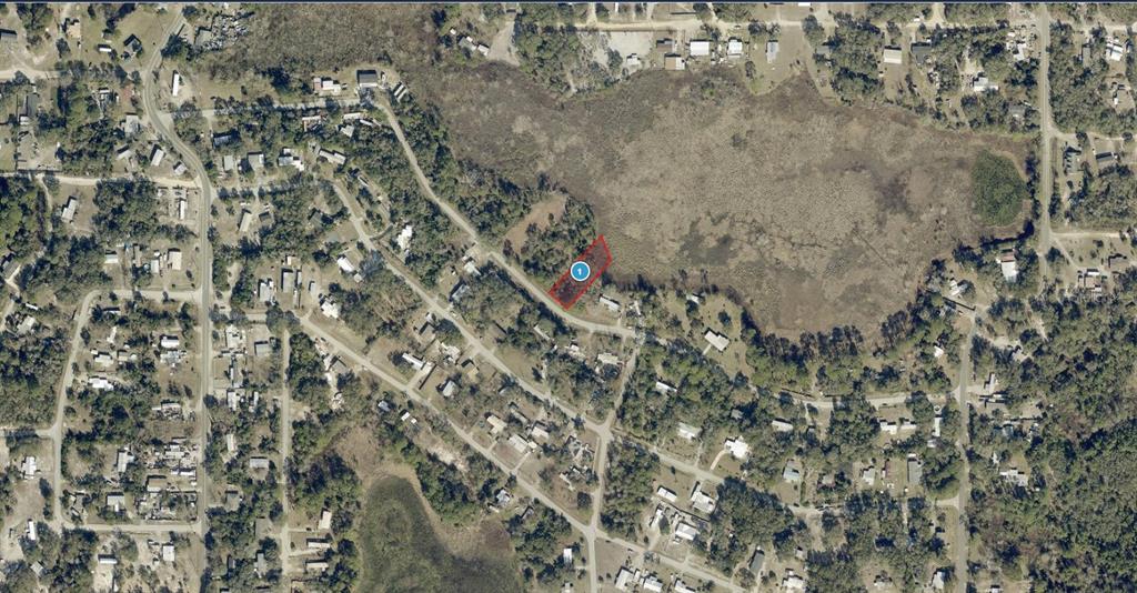 An aerial map view shows a highlighted rectangular parcel of land bordering a large wetland — LAKESIDE DRIVE, DELAND, FL