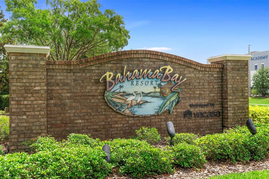 A brick entrance sign for Bahama Bay Resort sits in front of green landscaping — 607 GRAN BAHAMA BOULEVARD UNIT B29/U607, DAVENPORT, FL