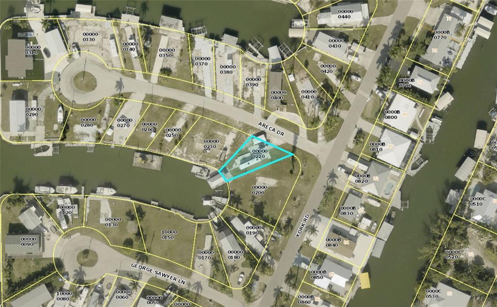 This is an aerial map showing a residential property highlighted in blue along a canal — 3881 ARECA DRIVE, ST JAMES CITY, FL