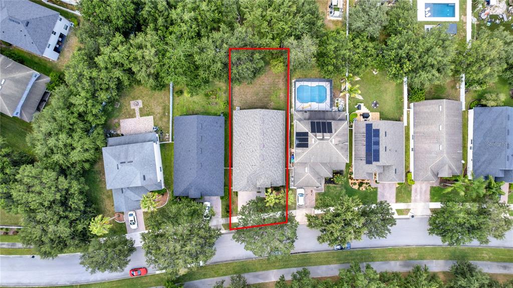 This aerial view shows a residential house lot outlined in red within a suburban neighborhood — 11513 MOSSY OAK DRIVE, ORLANDO, FL