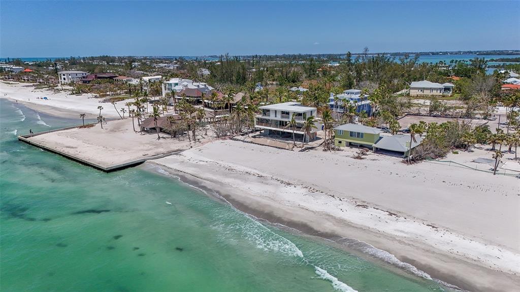 An aerial view of a cleared, sandy residential lot surrounded by palm trees and vegetation — 6601 GULFSIDE ROAD, LONGBOAT KEY, FL