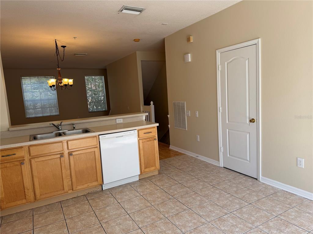 A kitchen with light wood cabinets, a white dishwasher, and tiled flooring — 3146 BAYSHORE OAKS DRIVE, TAMPA, FL