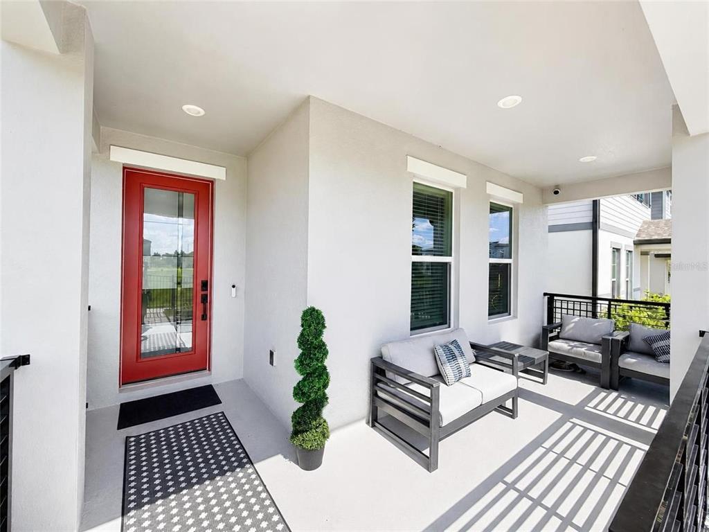 A home gym in a garage with black walls, a hexagonal LED ceiling, and equipment — 4981 CORAL BEAN ALLEY, WINTER GARDEN, FL