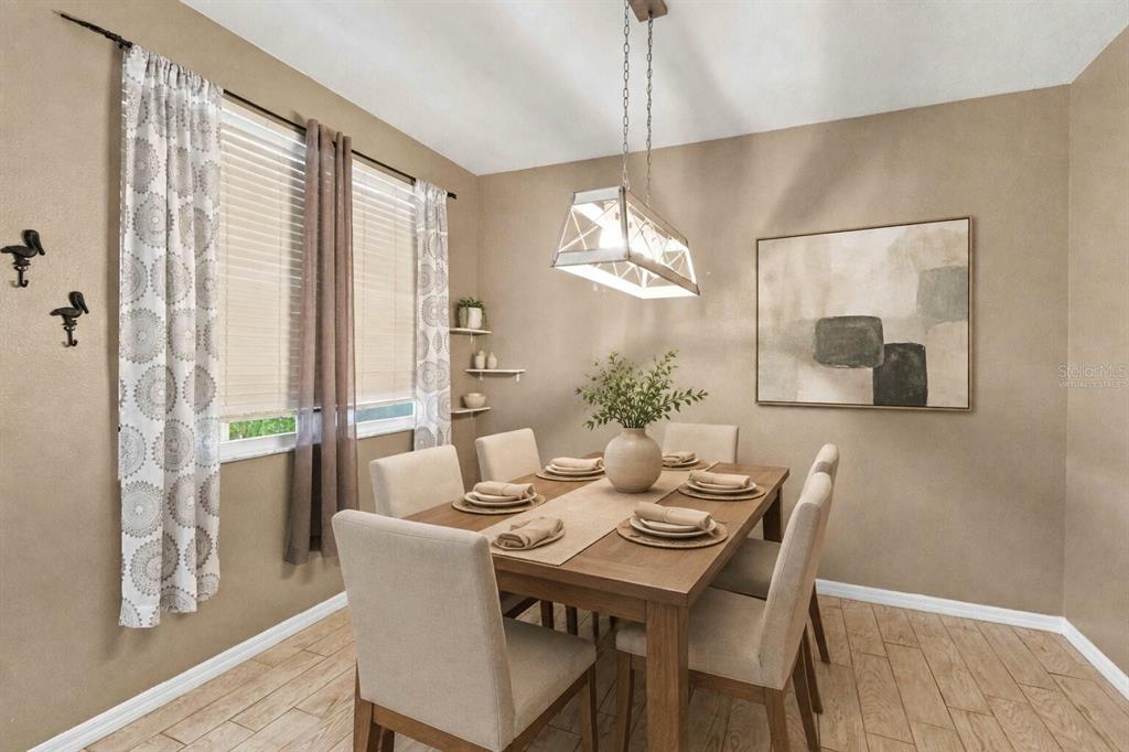 A dining room features a wooden table with six chairs, a pendant light, and curtains — 34928 TEEVIEW LANE, ZEPHYRHILLS, FL