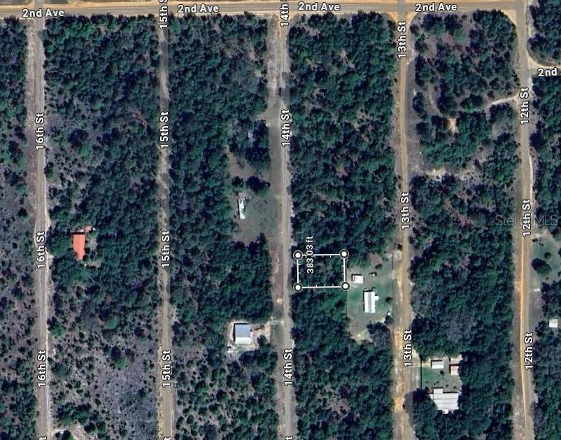 This aerial map shows a rectangular plot of land highlighted between 14th and 13th Street — 228 14TH STREET, INTERLACHEN, FL