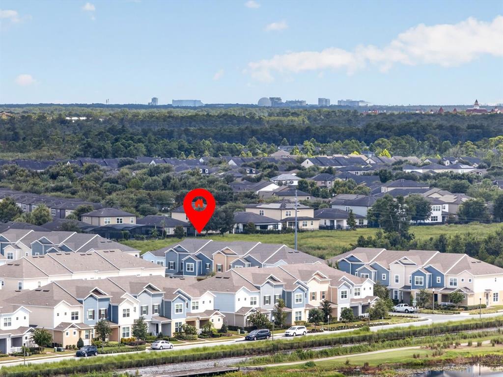 An aerial view shows a suburban neighborhood with multi-story houses and a red location pin — 6982 TWILIGHT BAY DRIVE, WINTER GARDEN, FL
