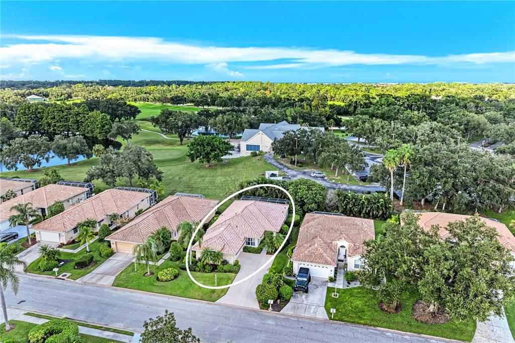 An aerial view shows a residential neighborhood with a circled single-story house and surrounding trees — 6622 OAKBROOKE CIRCLE, BRADENTON, FL