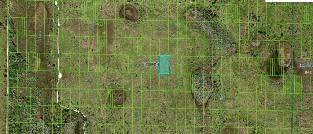 This is a satellite map showing a highlighted rectangular parcel of land among surrounding lots — N/A, FROSTPROOF, FL