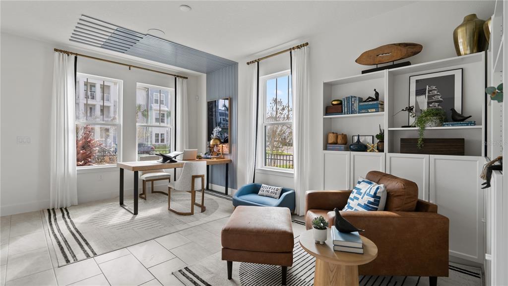 A home office features a desk, a leather armchair with an ottoman, and built-in shelving — 15153 GROVESIDE ROAD, WINTER GARDEN, FL