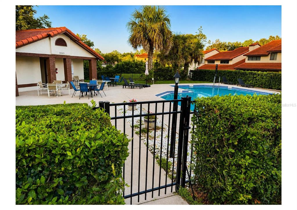 A front entryway features a concrete walkway, a white front door, and a brick wall — 3340 GRAY FOX COVE UNIT 3340, APOPKA, FL