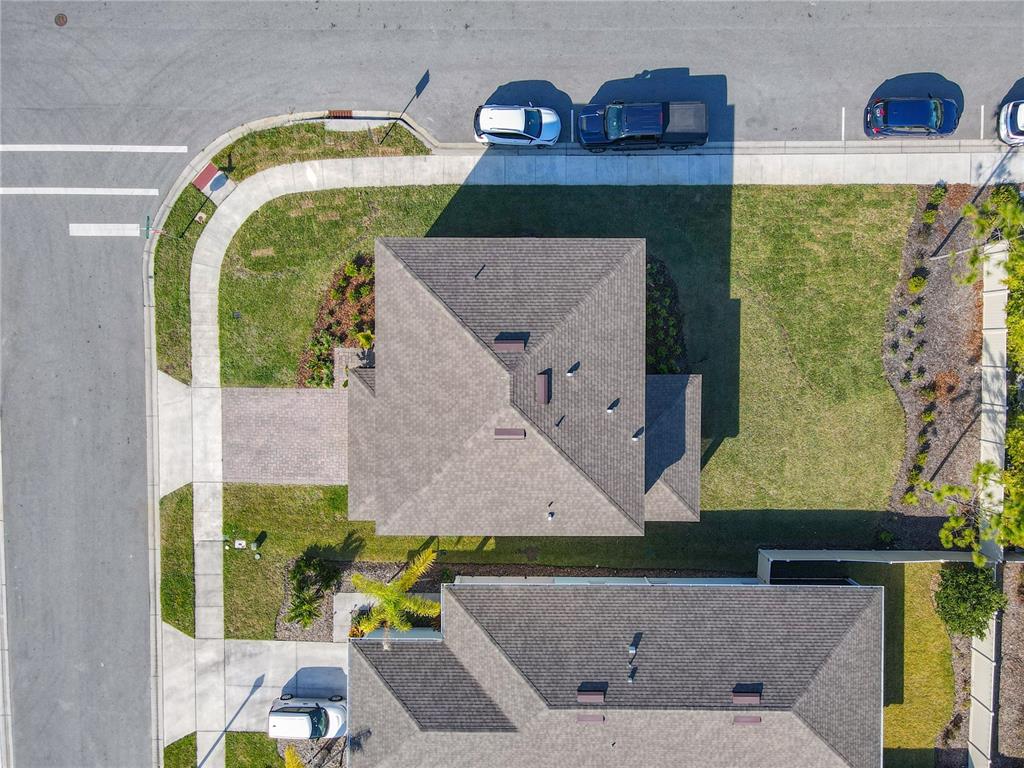 An aerial view shows two houses with shingled roofs, driveways, and surrounding lawns — 2248 CANOPY TERRACE BOULEVARD, DELAND, FL